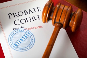 Documents for probate court sitting under a gavel, part of probate law in Peoria IL