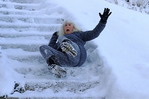 A woman who slipped and fell on a wintry staircase should contact a Personal Injury Lawyer like Rochford & Associates