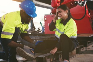 A woman who has been injured on the job gets help from a co-worker. If you're in a situation like this, call Rochford & Associates, who know Workers Comp in East Peoria IL.
