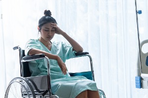 A patient sits in a wheelchair after being harmed by a medical professional. Contact Rochford & Associates, a Medical Malpractice Attorney in East Peoria IL.