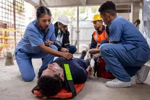 A man lays on a stretcher after getting hurt on the job. If you need help Filing Injury Claims in East Peoria IL, choose Rochford & Associates